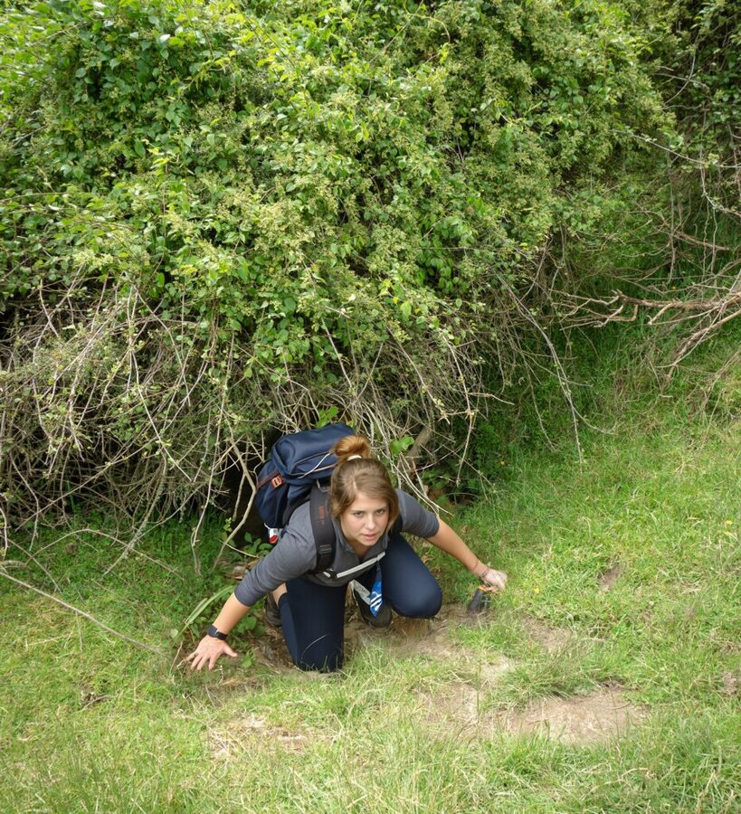 Climbing out through one of the cave entrances
