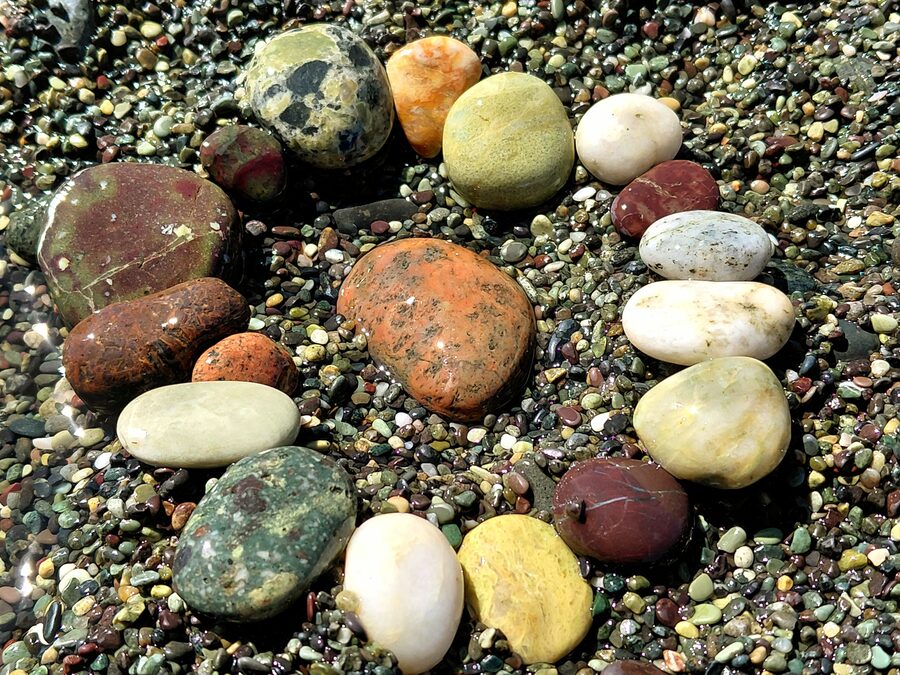 A handful of the garnet, quartz and jasper pebbles that give the beach its name