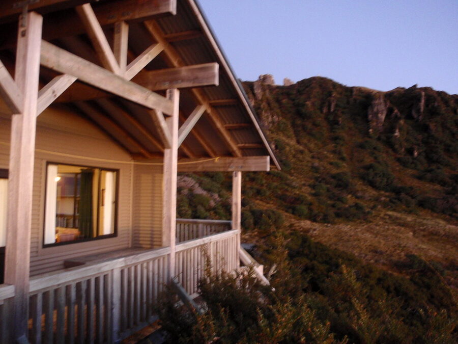 Okaka Lodge's veranda at dusk, looking out over the ridge