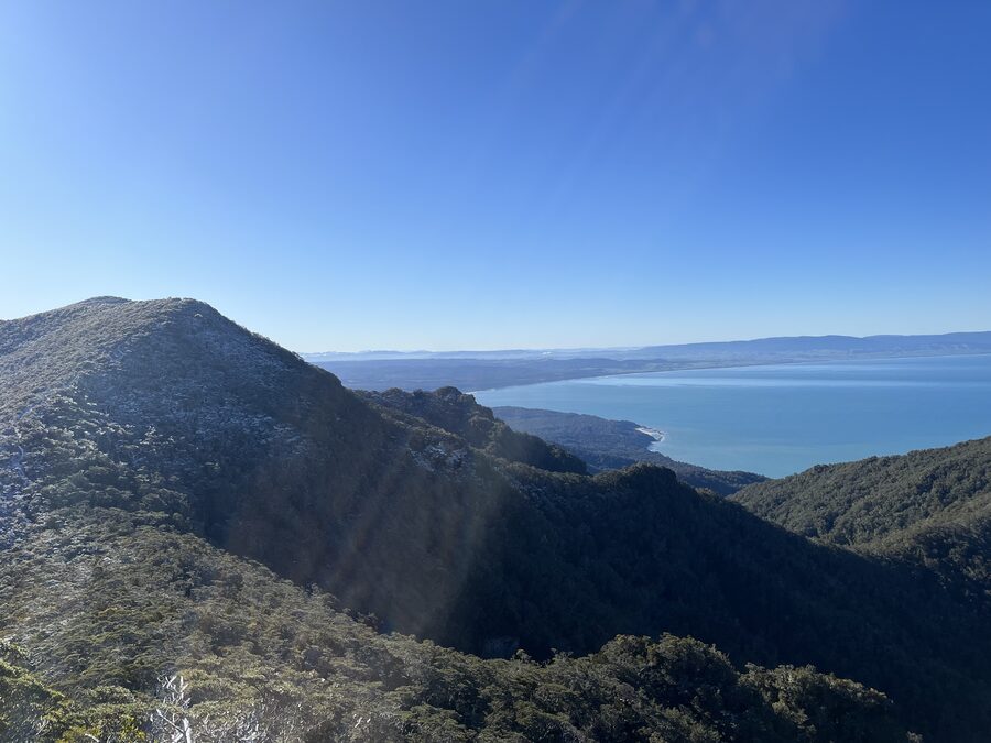 Looking back along the ridge to Te Waewae Bay, dusted in snow