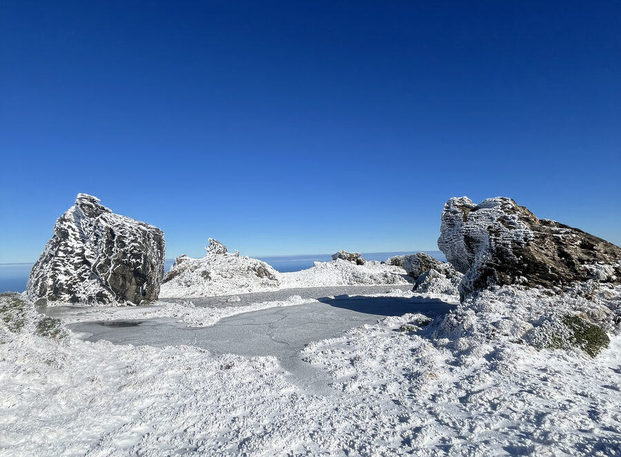 A frozen tarn on the tops after a winter storm