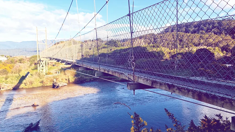 The Waikoau River swingbridge, looking across to the far bank