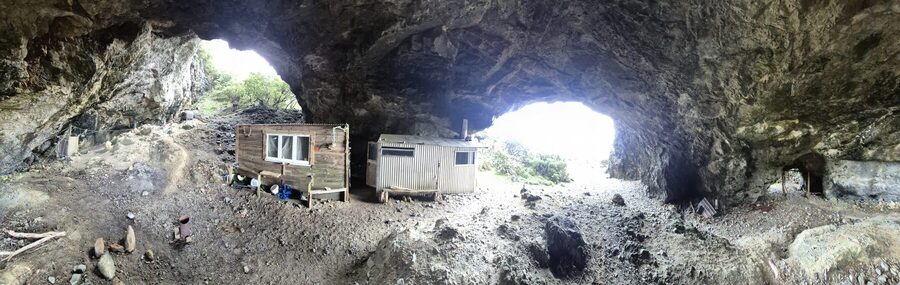 Both ends of the cave, with the hut in the middle