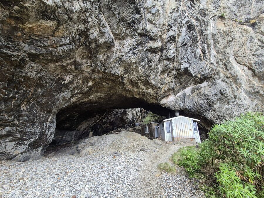 Approaching the hut through the sea cave